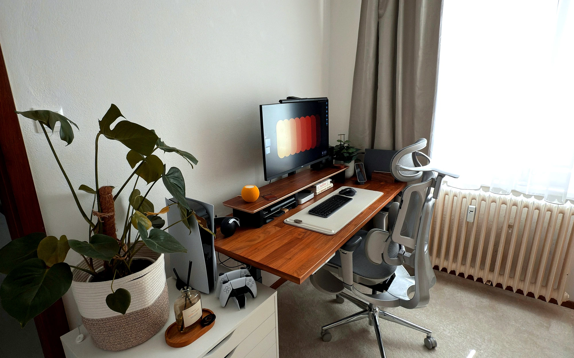 Home office desk wrapped in dark wood and matte neutral